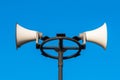 White megaphone on the old pole and bluesky Royalty Free Stock Photo