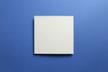 White memo pad, empty paper on dark blue background Royalty Free Stock Photo