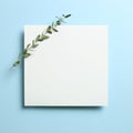 White memo pad, empty paper with eucalyptus leaves on sky blue background