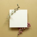 White memo pad with eucalyptus leaf and red fruit on brown background Royalty Free Stock Photo