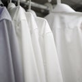 White men`s shirts on hangers in wardrobe Royalty Free Stock Photo