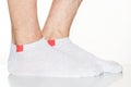 white men's socks with a red insert on the feet, legs in socks on a white background Royalty Free Stock Photo