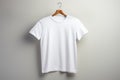 Ai generated white men\'s t-shirt mockup template hanging on a hanger on a light neutral background Royalty Free Stock Photo