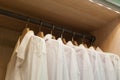White men shirts hanging in closet Royalty Free Stock Photo