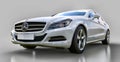 White Mercedes Benz CLS Coupe on a gray background. 3d rendering. Royalty Free Stock Photo