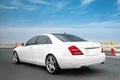 White Mercedes S500 on a test drive on a high way. Sport car. Luxury lifestyle