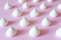 White meringue on a pink background