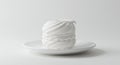 A white meringue sits on a simple white ceramic plate. The meringue features a Royalty Free Stock Photo