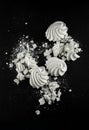 White meringues candy on black slate plate kitchen table Royalty Free Stock Photo