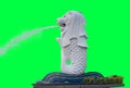 White Merlion fountain statue isolated on green background with clipping paths inside. Singapore City landmark and major tourist Royalty Free Stock Photo