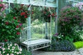 White metal arch bench in indoor park in the Royal flora public garden in Chiangmai,