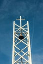 White Metal Bell Tower Against a Blue Sky Royalty Free Stock Photo