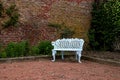 White Metal Bench in a Country House Garden Royalty Free Stock Photo