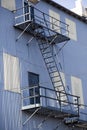 White Metal and Blue Metal Building with Fire Escape