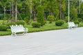 White metal chairs in the park for sitting and rest. Royalty Free Stock Photo