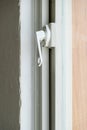 White metal handle on the glass door