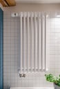 White metal heating radiator with thermostat in room Royalty Free Stock Photo