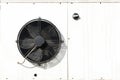 White metal housing air conditioning, black fan blades