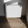 White metal radiator to heat the house and apartment Royalty Free Stock Photo