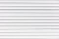 White metal roller shutter door texture background. Texture of white metal roller shutter door Royalty Free Stock Photo