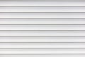 White metal roller shutter door texture background. Texture of white metal roller shutter door Royalty Free Stock Photo