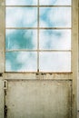 a white metallic doorway with a window