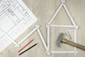 White meter tool forming a house and engineering tools on woode