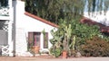 White mexican old house, window and garden, succulent cactus plant, California. Royalty Free Stock Photo