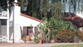 White mexican old house, window and garden, succulent cactus plant, California. Royalty Free Stock Photo