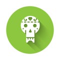 White Mexican skull icon isolated with long shadow. Green circle button. Vector