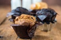 White milk and chocolate baked muffins - wooden background