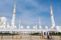 White Minaret of  Grand Mosque against blue sky, also called Sheikh Zayed BinSultan Nahyan Mosque, inspired by Persian, Mughal and Royalty Free Stock Photo