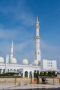 White Minaret of  Grand Mosque against blue sky, also called Sheikh Zayed BinSultan Nahyan Mosque, inspired by Persian, Mughal and Royalty Free Stock Photo