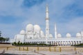 White Minaret of  Grand Mosque against blue sky, also called Sheikh Zayed BinSultan Nahyan Mosque, inspired by Persian, Mughal and Royalty Free Stock Photo