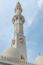 White minaret of mosque against the sky in Abu Dhabi, UAE