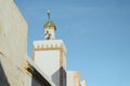 White minaret tower at local mosque