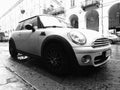 white Mini car in Turin in black and white Royalty Free Stock Photo