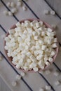White Mini Marshmallows in a Pink Bowl, overhead view. Flat lay, top view, from above Royalty Free Stock Photo