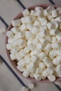 White Mini Marshmallows in a Pink Bowl, overhead view. Flat lay, top view, from above Royalty Free Stock Photo