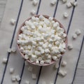 White Mini Marshmallows in a Pink Bowl, top view. Flat lay, overhead, from above Royalty Free Stock Photo