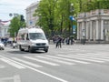 Sankt- Petersburg, Russia - May 28, 2017: White minibus moving along Nevsky Prospekt in St. Petersburg, Russia