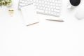 White minimal office desk table with computer keyboard, mouse and supplies. Top view with copy space, flat lay Royalty Free Stock Photo