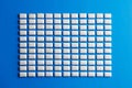 White mint chewing gum pieces in rectangle on blue background Royalty Free Stock Photo