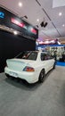 White Mitsubishi Lancer Evolution IX sedan in Indonesia Modification Expo 2023