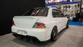 White Mitsubishi Lancer Evolution IX sedan in Indonesia Modification Expo 2023