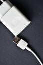 White mobile phone charger on black background Royalty Free Stock Photo