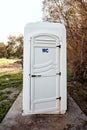 White mobile portable toilet