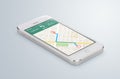 White mobile smartphone with map gps navigation app lies on the Royalty Free Stock Photo