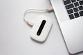 White mobile WiFi connected to laptop Royalty Free Stock Photo