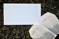 White mockup and tea bags on a loose leaf tea background Royalty Free Stock Photo